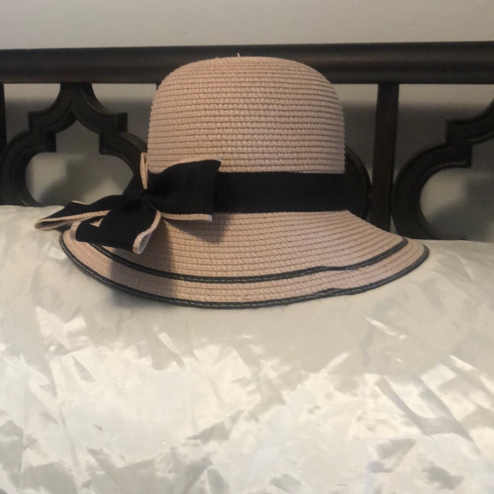 One size fits all pink hat with black bow accent
